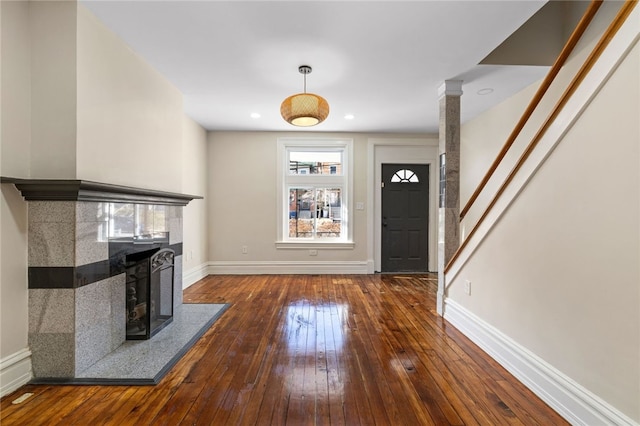 927 Greenfield Ave, Greenfield, PA 15217 - unfurnished living room with visible vents, hardwood / wood-style floors, recessed lighting, a fireplace, and baseboards