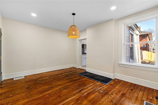 927 Greenfield Ave, Greenfield, PA 15217 - spare room with visible vents, baseboards, and dark wood finished floors