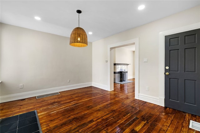 927 Greenfield Ave, Greenfield, PA 15217 - kitchen featuring white cabinetry, light wood-style floors, appliances with stainless steel finishes, decorative backsplash, and light stone countertops