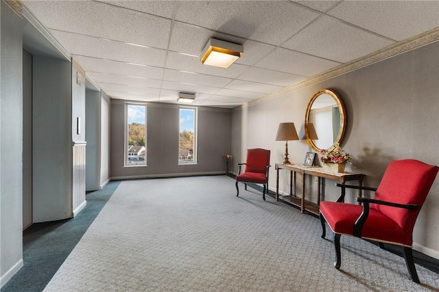 community lobby with a drop ceiling and crown molding