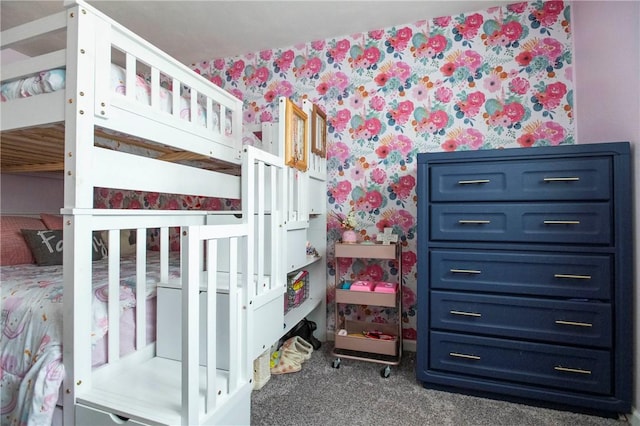 bedroom with wallpapered walls and carpet floors