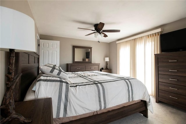 bedroom with light colored carpet and ceiling fan