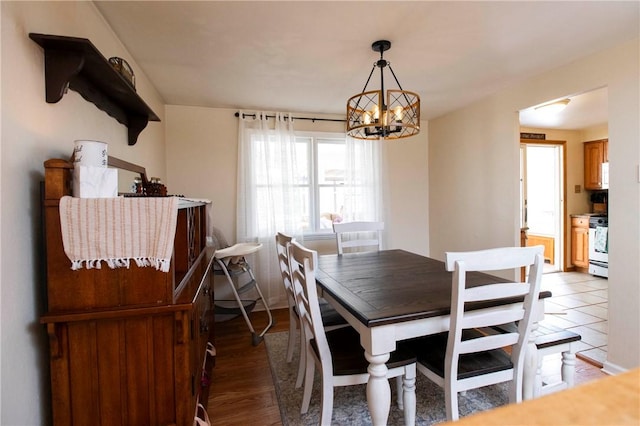 dining room featuring a chandelier and light wood finished floors
