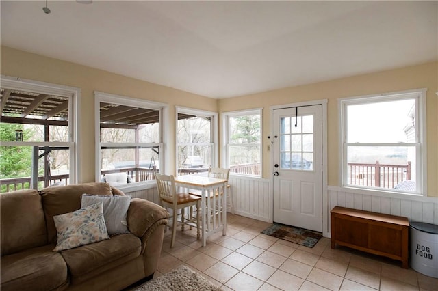 sunroom / solarium with tile patterned flooring and a wealth of natural light