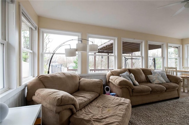 living room featuring a ceiling fan