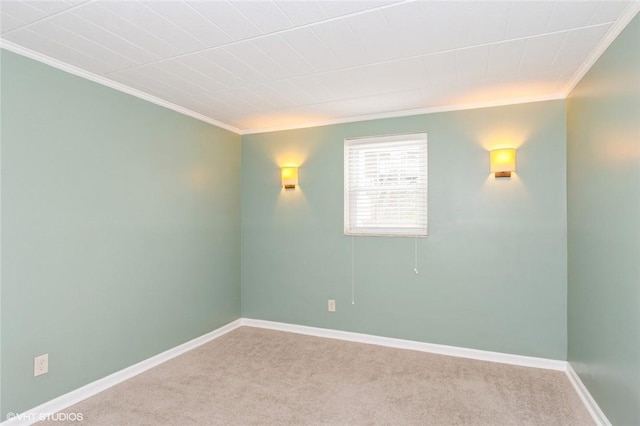 unfurnished room with carpet flooring, baseboards, and ornamental molding