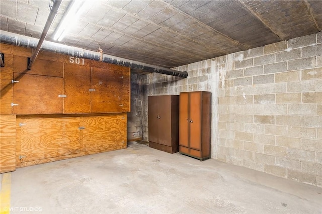 interior space featuring concrete block wall