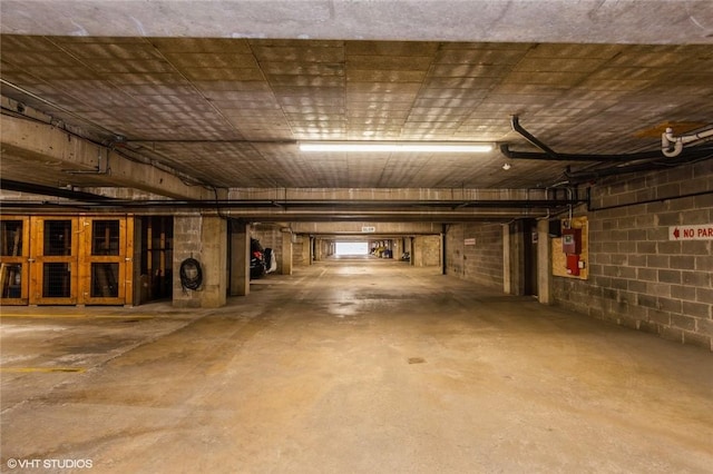 parking deck featuring concrete block wall