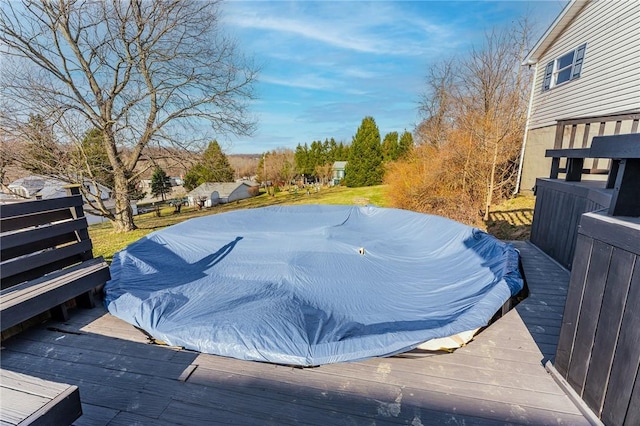 view of pool with a wooden deck