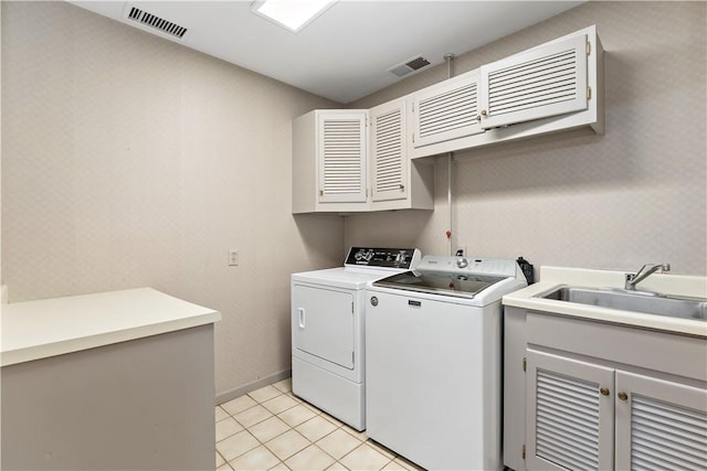 2172 Hycroft Dr, Upper St Clair, PA 15241 - laundry room featuring cabinet space, separate washer and dryer, light tile patterned floors, and baseboards