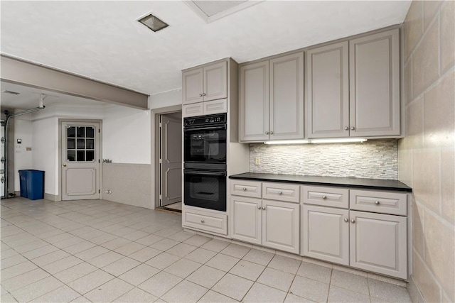 2172 Hycroft Dr, Upper St Clair, PA 15241 - kitchen with dark countertops, light tile patterned flooring, tasteful backsplash, and gray cabinetry