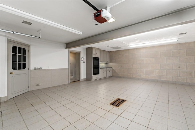 2172 Hycroft Dr, Upper St Clair, PA 15241 - interior space with a garage door opener and concrete block wall