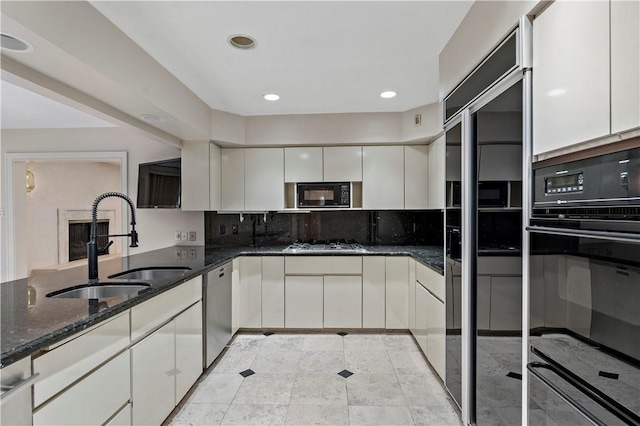 2172 Hycroft Dr, Upper St Clair, PA 15241 - kitchen with black appliances, a sink, white cabinets, dark stone counters, and recessed lighting