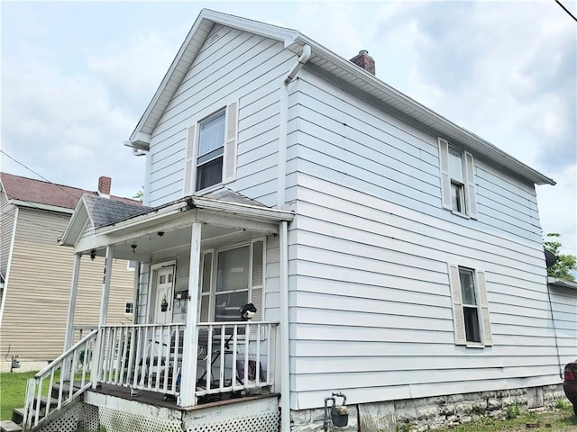 848 Arlington Ave, New Castle/5Th, PA 16101 - rear view of property featuring a chimney and covered porch
