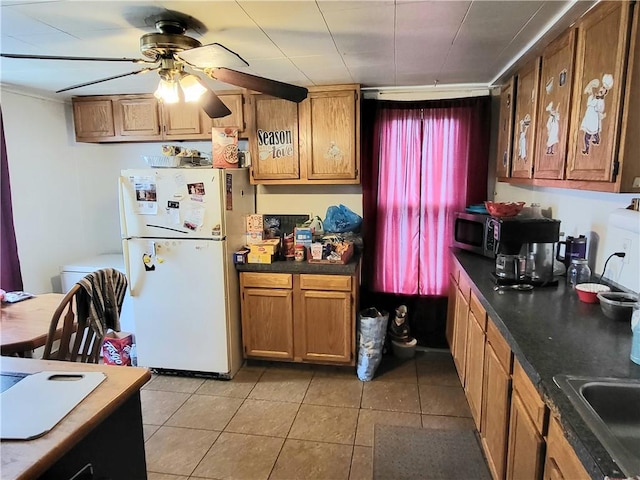 848 Arlington Ave, New Castle/5Th, PA 16101 - kitchen featuring freestanding refrigerator, stainless steel microwave, a ceiling fan, dark countertops, and light tile patterned floors