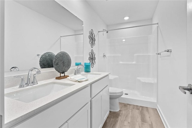 121 Samantha Dr, Center Twp, PA 15061 - bathroom featuring wood finished floors, double vanity, and a shower