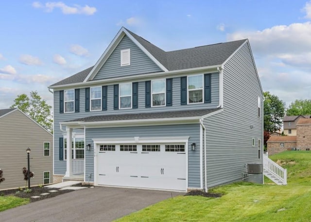 130 Arnoni Dr, Jefferson Hills, PA 15025 - traditional-style house with an attached garage, a front lawn, driveway, and stairs