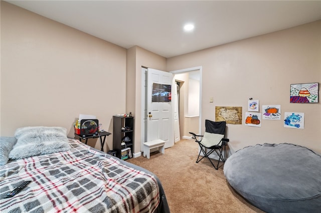 bedroom featuring baseboards and light colored carpet