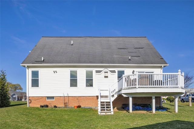 rear view of house featuring stairs, a lawn, and a wooden deck