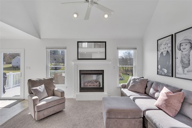 carpeted living area featuring recessed lighting, a ceiling fan, a tiled fireplace, and vaulted ceiling