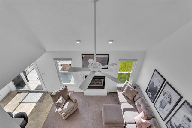 living room featuring a healthy amount of sunlight and baseboards