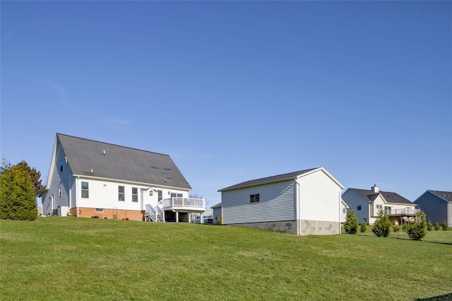 back of house featuring crawl space, a yard, and a wooden deck