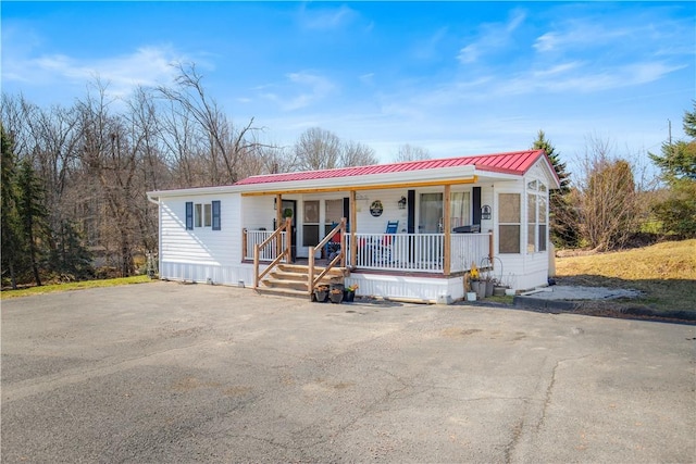 260 Stouffer Hill Rd, Somerset Twp, PA 15541 - view of front of house featuring a porch and metal roof