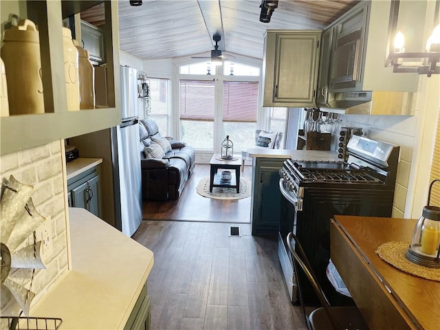 260 Stouffer Hill Rd, Somerset Twp, PA 15541 - kitchen with stainless steel gas range oven, vaulted ceiling with beams, wood ceiling, a ceiling fan, and dark wood-style flooring