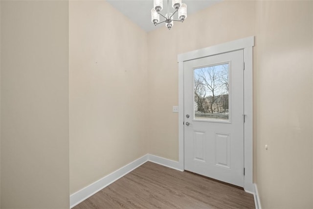 1223 Center Ave, West View, PA 15229 - entryway featuring an inviting chandelier, wood finished floors, and baseboards
