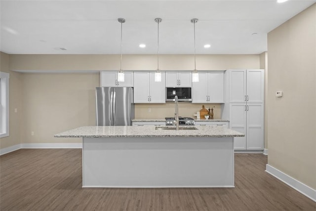 1223 Center Ave, West View, PA 15229 - kitchen featuring baseboards, appliances with stainless steel finishes, a center island with sink, and dark wood-style flooring
