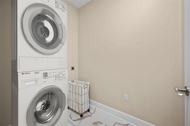 1223 Center Ave, West View, PA 15229 - washroom featuring laundry area, marble finish floor, stacked washing maching and dryer, and baseboards