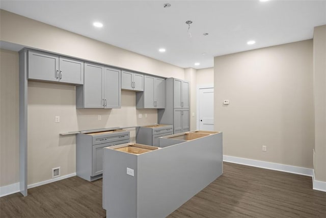 1223 Center Ave, West View, PA 15229 - kitchen featuring gray cabinets, a center island, baseboards, and dark wood-style flooring