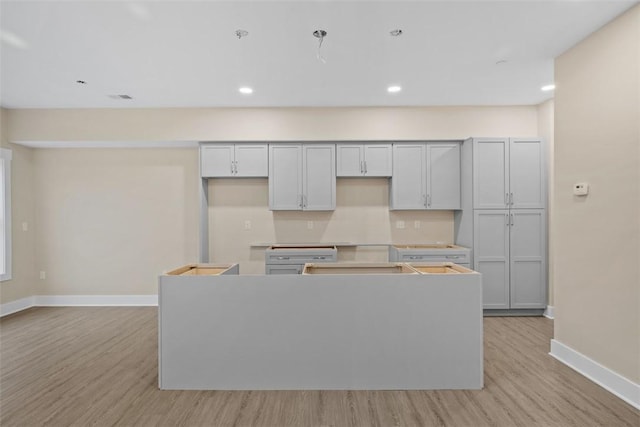 1223 Center Ave, West View, PA 15229 - kitchen with recessed lighting, light wood-type flooring, baseboards, and a center island