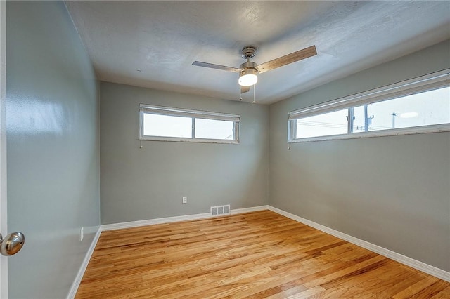 159 Mardi Gras Dr, Plum Boro, PA 15239 - spare room with visible vents, baseboards, light wood-style floors, and a ceiling fan