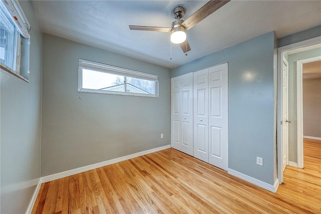 159 Mardi Gras Dr, Plum Boro, PA 15239 - unfurnished bedroom with a closet, baseboards, light wood-style flooring, and a ceiling fan