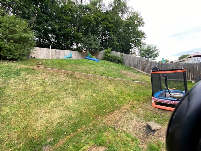 159 Mardi Gras Dr, Plum Boro, PA 15239 - view of yard featuring a trampoline and a fenced backyard