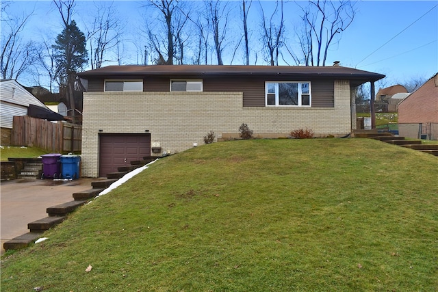 159 Mardi Gras Dr, Plum Boro, PA 15239 - view of front facade featuring brick siding, fence, a front yard, a garage, and driveway