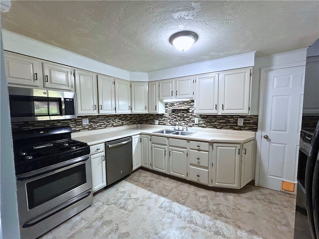 159 Mardi Gras Dr, Plum Boro, PA 15239 - kitchen featuring light countertops, tasteful backsplash, appliances with stainless steel finishes, and a sink