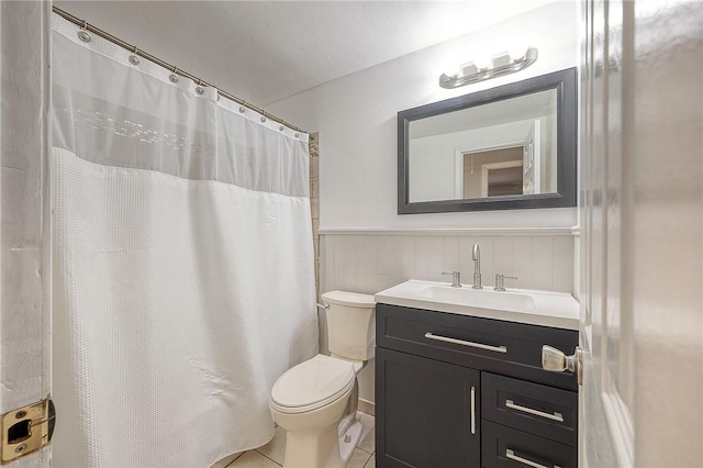 159 Mardi Gras Dr, Plum Boro, PA 15239 - full bath with vanity, a wainscoted wall, curtained shower, tile patterned floors, and toilet