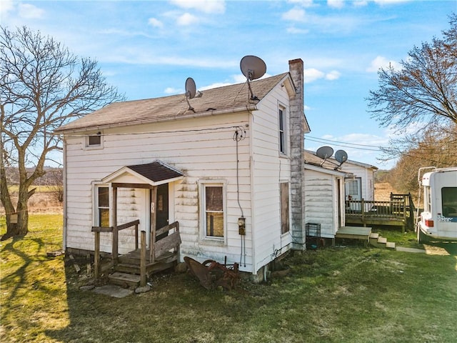 35 Falconbridge Ln, Stoneboro, PA 16153 - rear view of house featuring a lawn, a chimney, and a deck