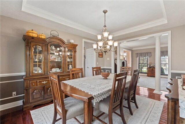 123 Windermere Ct, Peters Twp, PA 15317 - dining room featuring a raised ceiling, dark wood finished floors, ornamental molding, and a chandelier