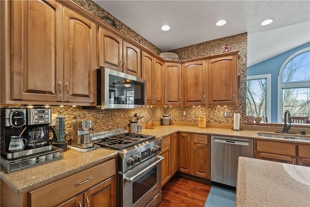 123 Windermere Ct, Peters Twp, PA 15317 - kitchen with appliances with stainless steel finishes, a sink, dark wood-style flooring, decorative backsplash, and recessed lighting
