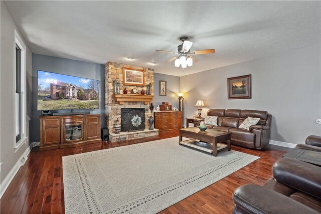 123 Windermere Ct, Peters Twp, PA 15317 - living area with baseboards, ceiling fan, a fireplace, dark wood finished floors, and plenty of natural light