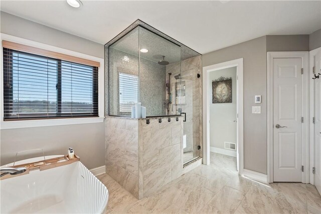 123 Windermere Ct, Peters Twp, PA 15317 - bathroom featuring a shower stall, baseboards, a soaking tub, and marble look tile flooring