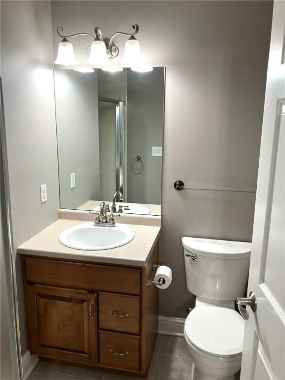 123 Windermere Ct, Peters Twp, PA 15317 - bathroom with tile patterned floors, vanity, toilet, and baseboards