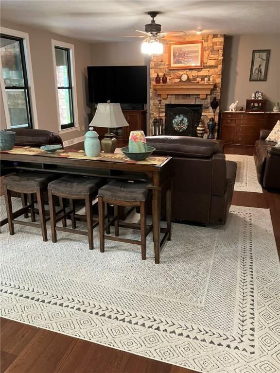 123 Windermere Ct, Peters Twp, PA 15317 - living room featuring a ceiling fan, wood finished floors, and a stone fireplace