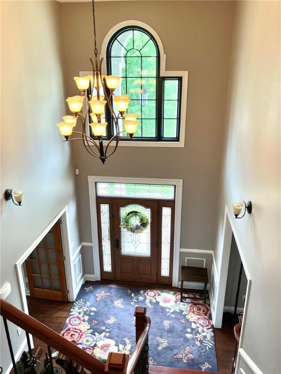 123 Windermere Ct, Peters Twp, PA 15317 - entryway with a towering ceiling, a chandelier, and wood finished floors