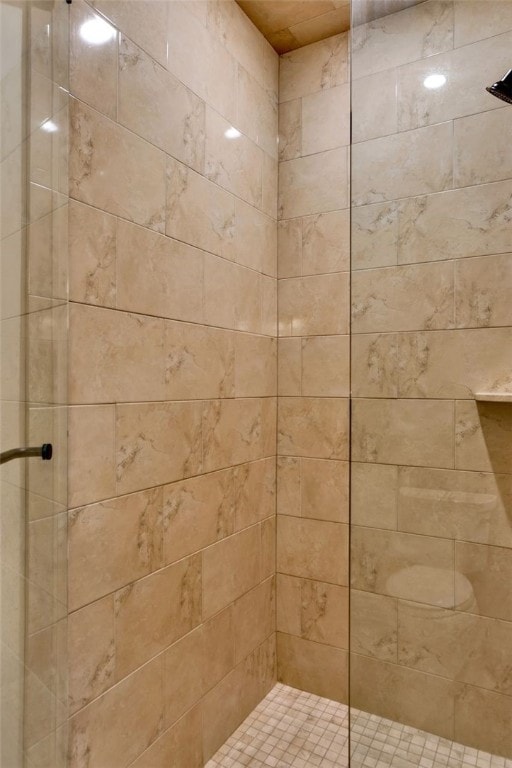 full bathroom with a tile shower