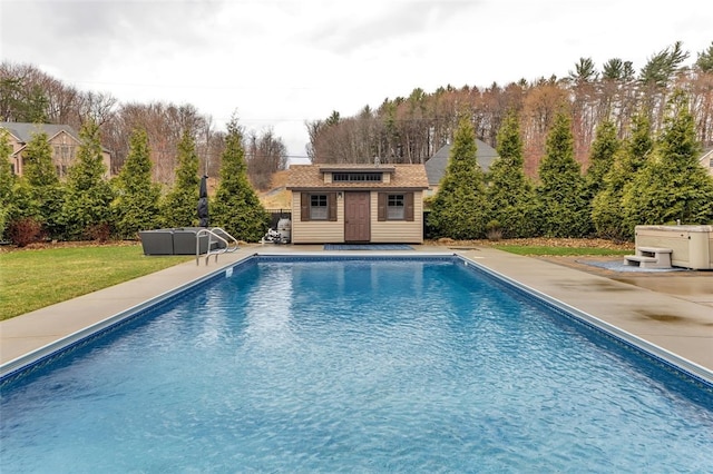 pool with a lawn, an outbuilding, a storage structure, and a patio area