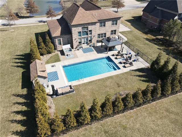 view of pool with fence, a lawn, a patio, and a fenced in pool